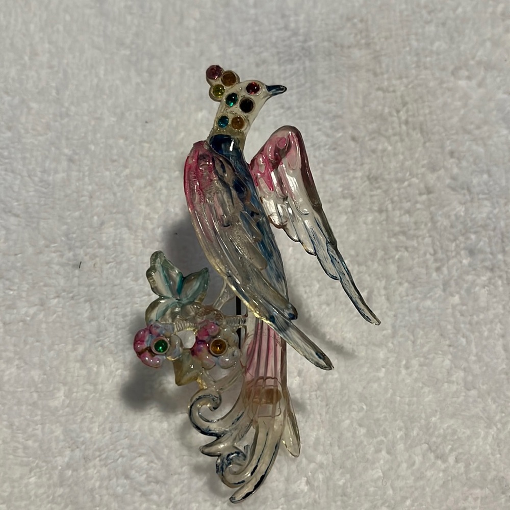 1930’s bird of paradise celluloid and rhinestone brooch.